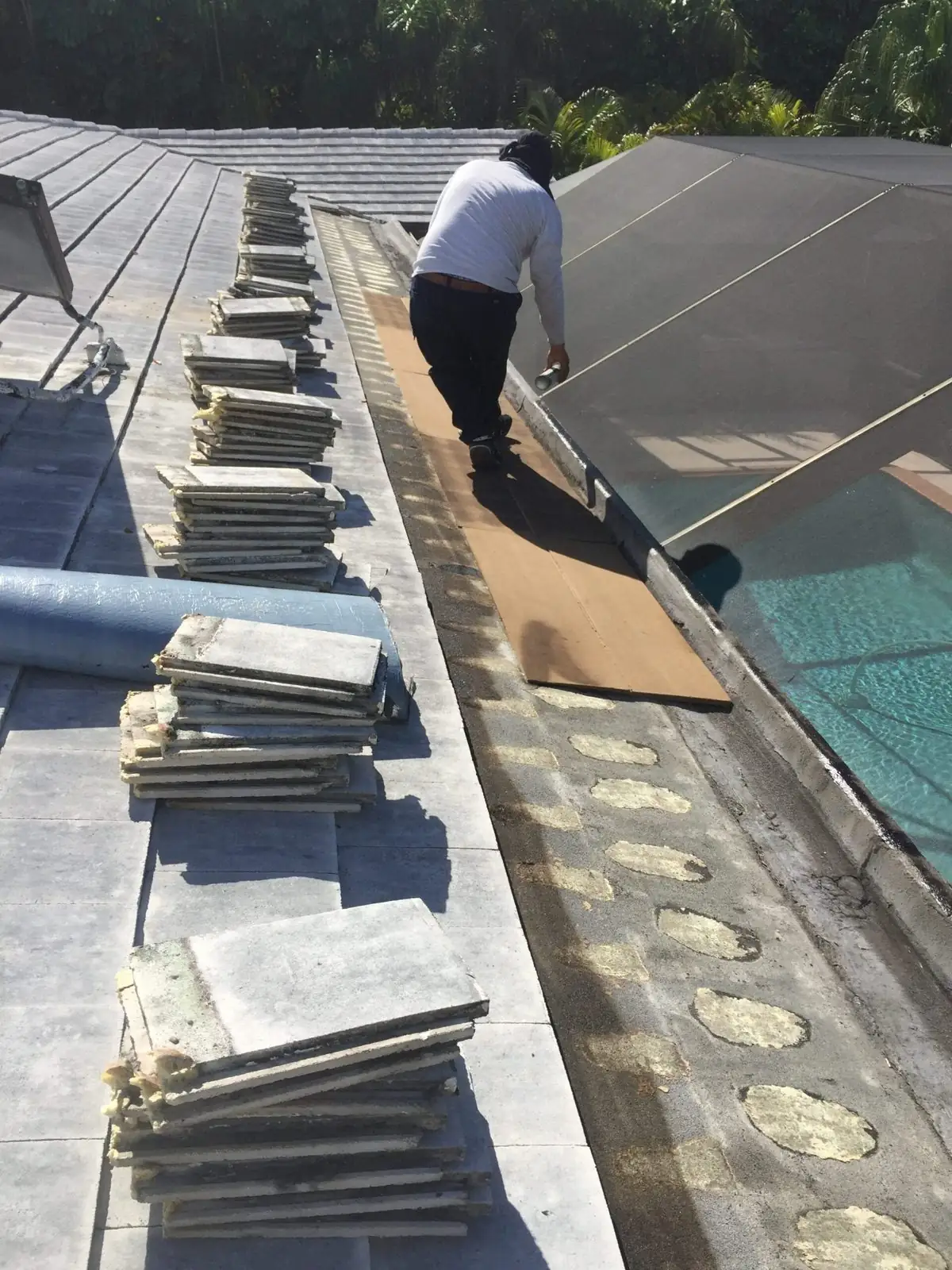 RTI Roofing worker on a tile roof repair in progress